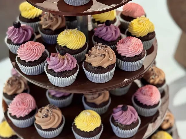 A cupcake tower with colourful frosting