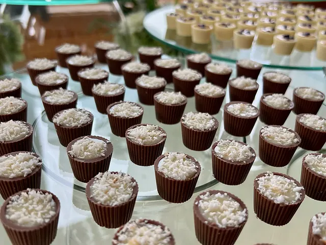 A dessert table with hundreds of filled chocolate cups