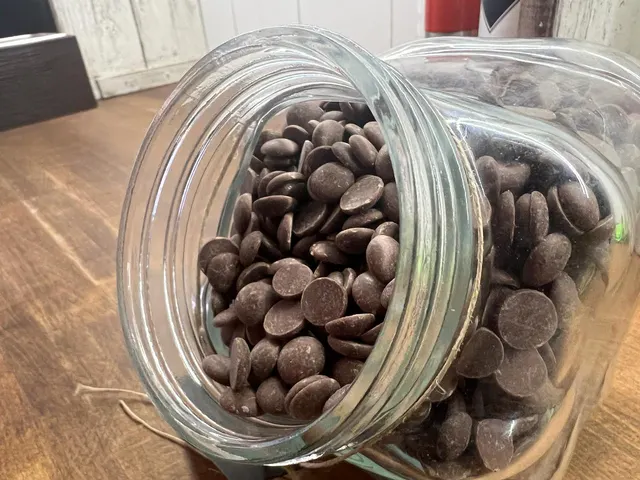 Dark chocolate drops in a jar
