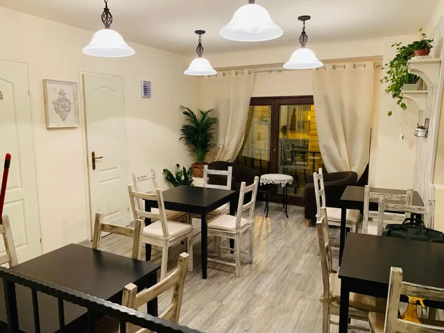 Seating area on the gallery with tables and armchairs