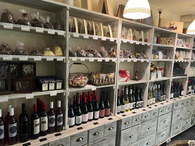 Chocolate drops, dragées and lollipops on the shelf