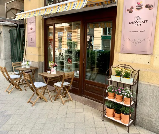The showroom entrance on Ráday Street with a terrace and flowers